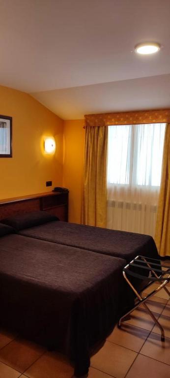Кровать или кровати в номере Hotel Ransol