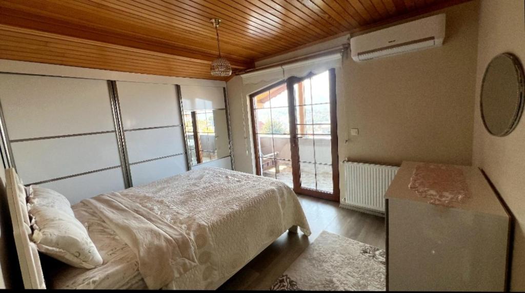 Postel nebo postele na pokoji v ubytování Yıldız Pansiyon