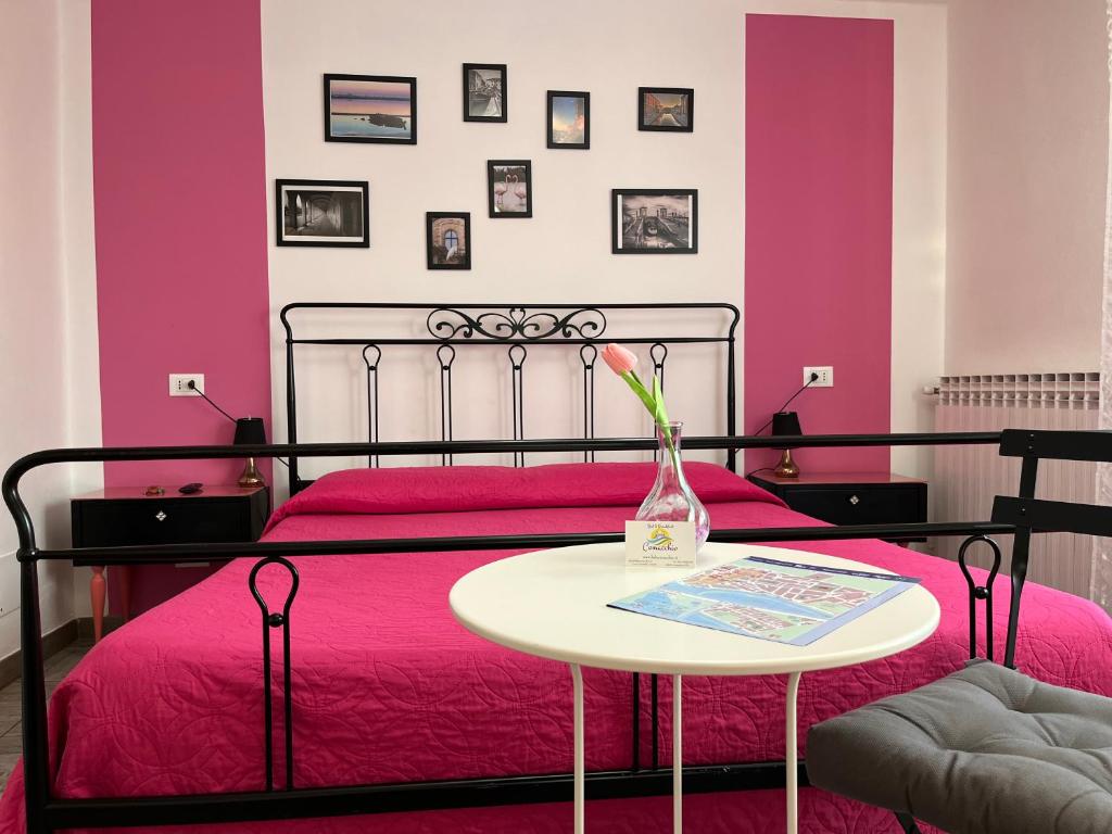 Postel nebo postele na pokoji v ubytování B&B Comacchio