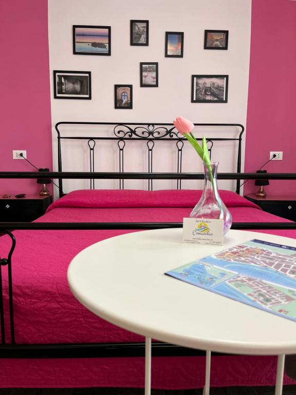 Postel nebo postele na pokoji v ubytování B&B Comacchio