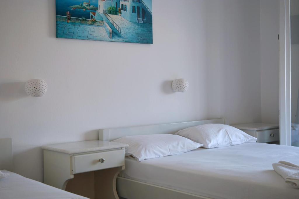 Postel nebo postele na pokoji v ubytování Theologos Place