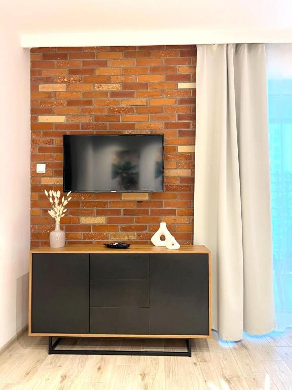 Televízia a/alebo spoločenská miestnosť v ubytovaní Apartament DanHouse