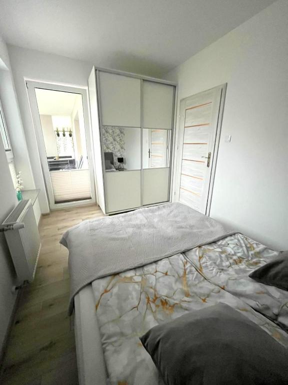 Posteľ alebo postele v izbe v ubytovaní Apartament DanHouse