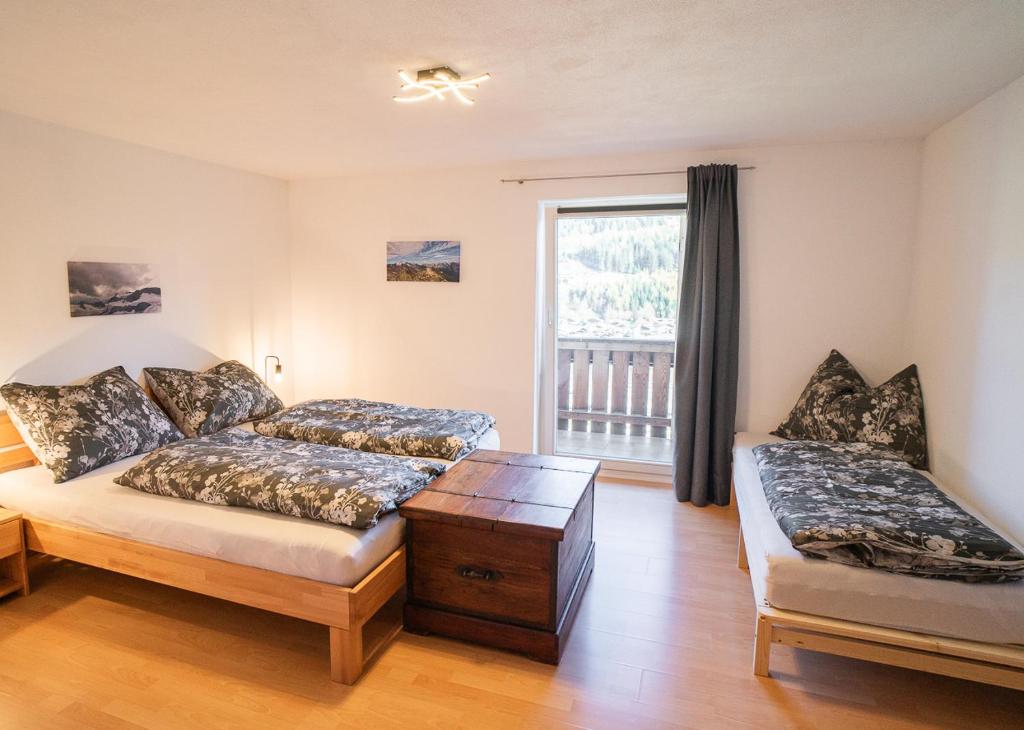 Postel nebo postele na pokoji v ubytování Haus Statz 48