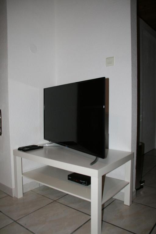 TV a/nebo společenská místnost v ubytování Apartment Au Calme