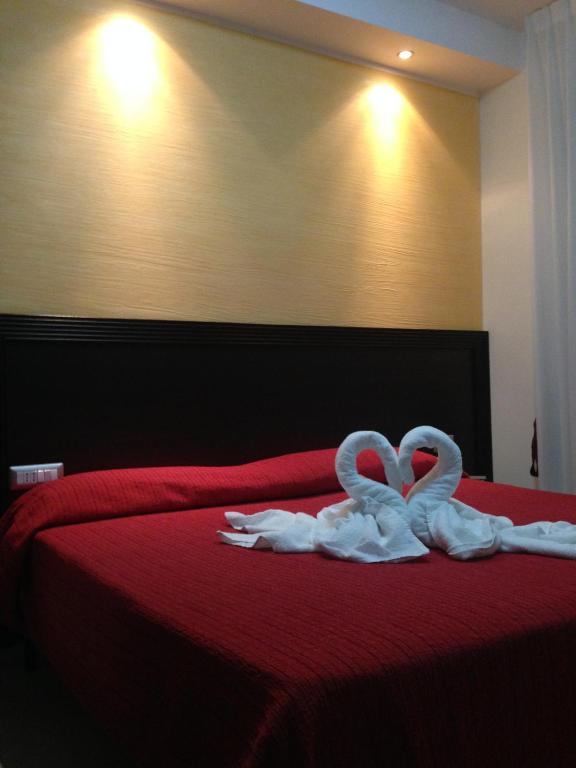 Postel nebo postele na pokoji v ubytování Hotel La Rosetta Scauri