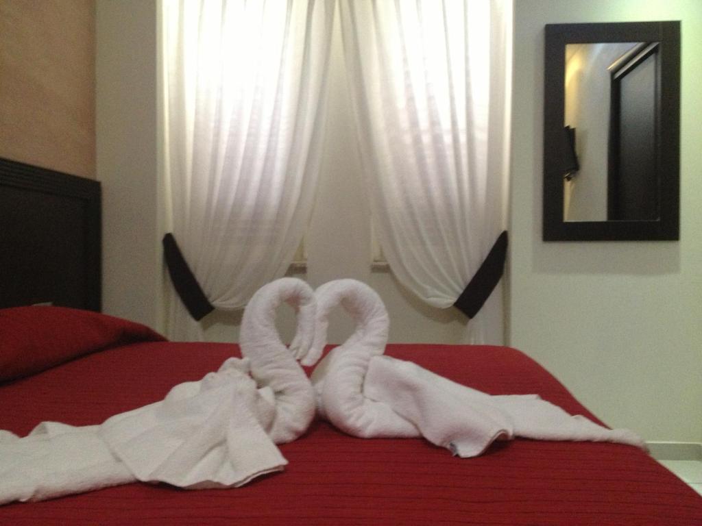 Postel nebo postele na pokoji v ubytování Hotel La Rosetta Scauri