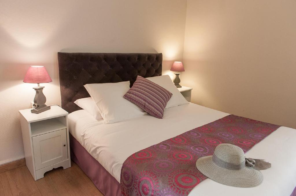 Postel nebo postele na pokoji v ubytování Hotel Sainte Anne - Apt