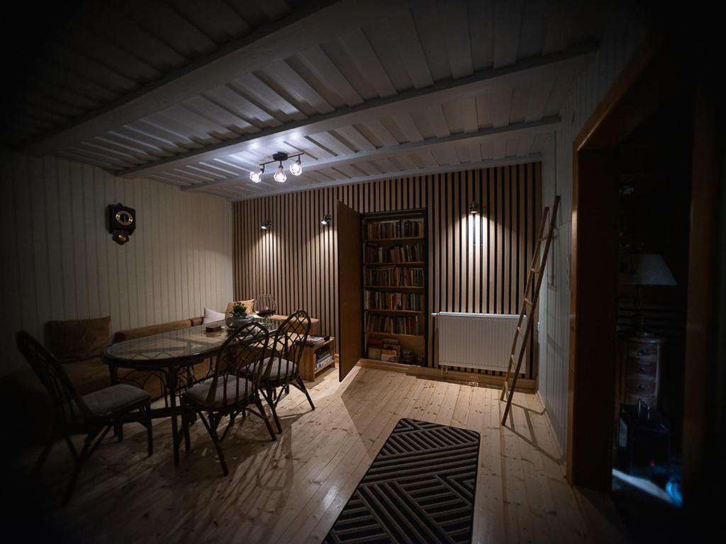 a dining room with a table and chairs in a room at Chopina 43 in Karpacz