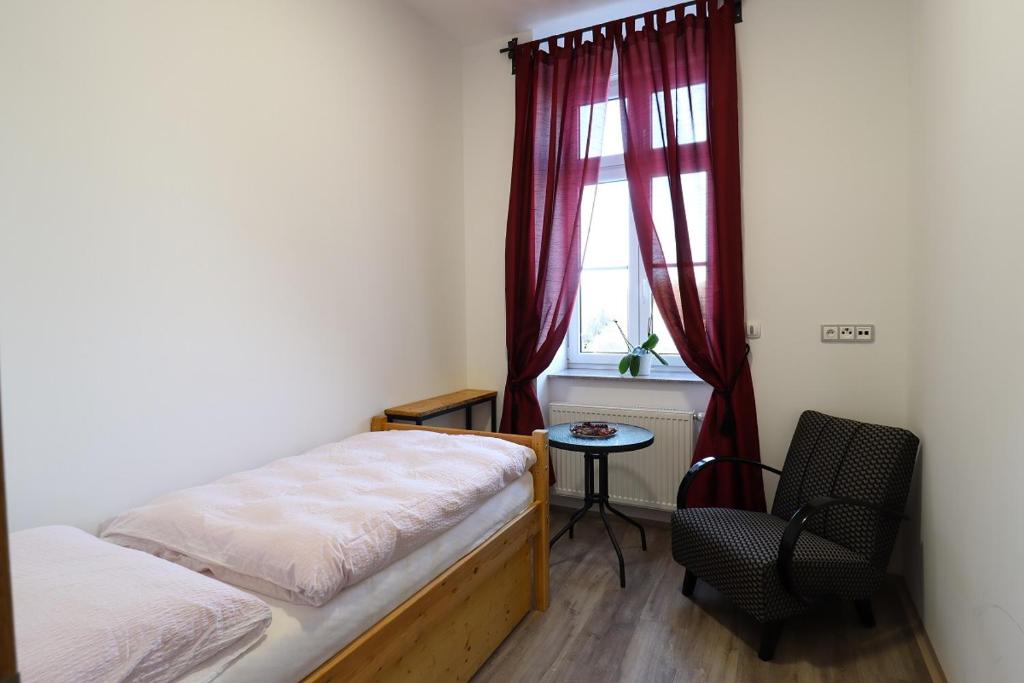 Postel nebo postele na pokoji v ubytování Penzion U HLAVÁČKŮ