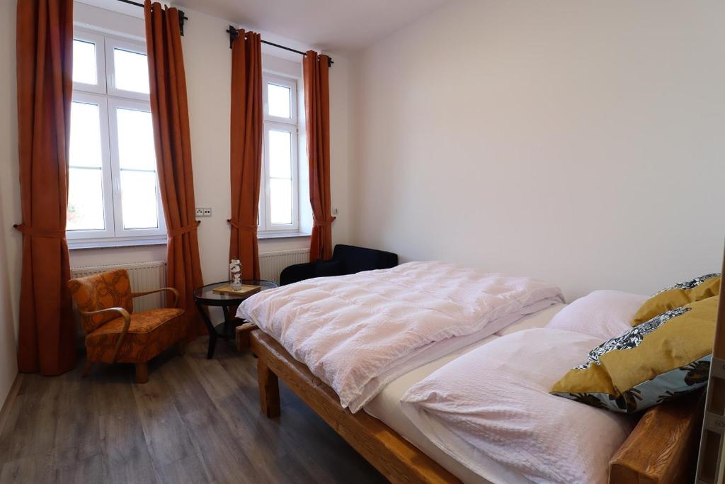Postel nebo postele na pokoji v ubytování Penzion U HLAVÁČKŮ