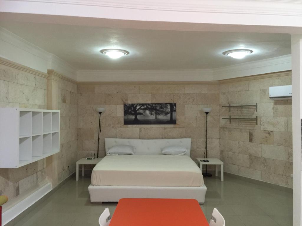 Postel nebo postele na pokoji v ubytování Apartahotel Guaraguao