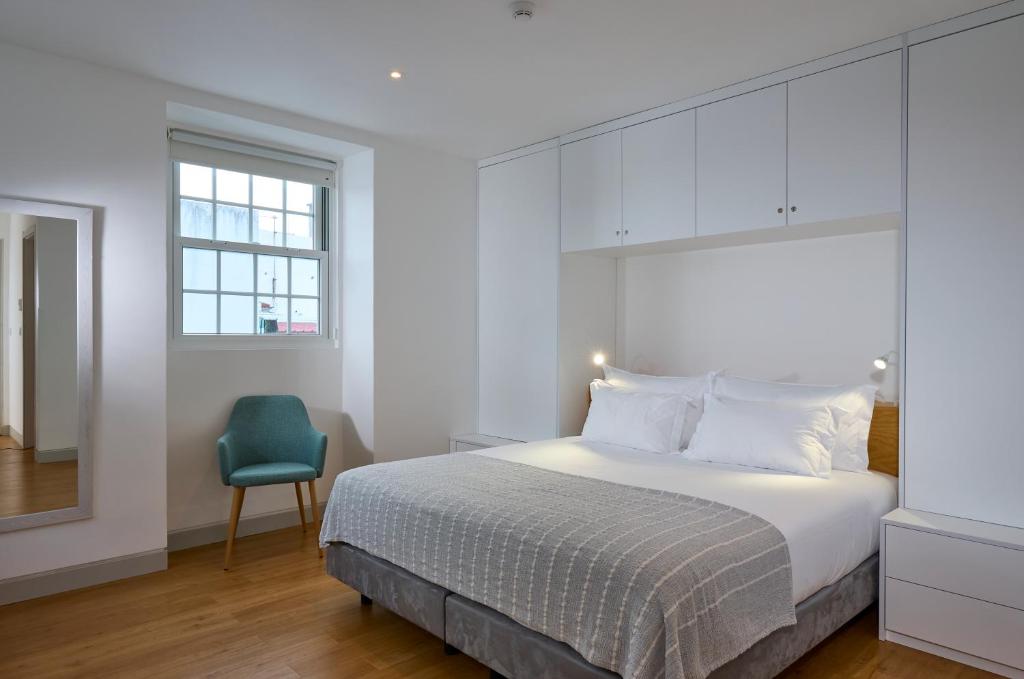 Postel nebo postele na pokoji v ubytování Matriz 55, Hostel & Suites