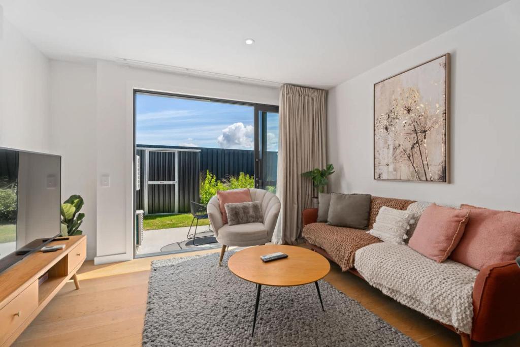 a living room with a couch and a table at Willow Lane in Albert Town