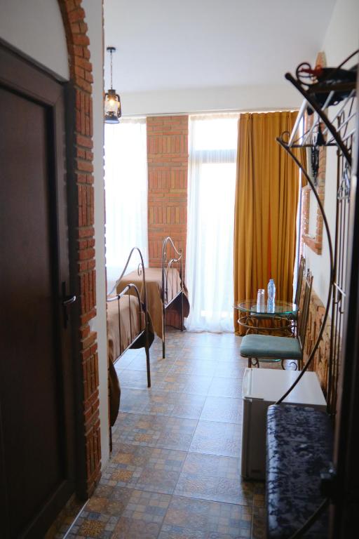 Postel nebo postele na pokoji v ubytování Janashia Boutique Hotels