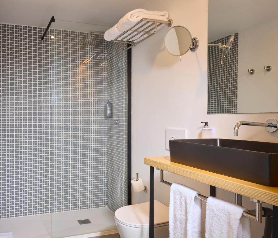 Koupelna v ubytování Matriz 55, Hostel & Suites
