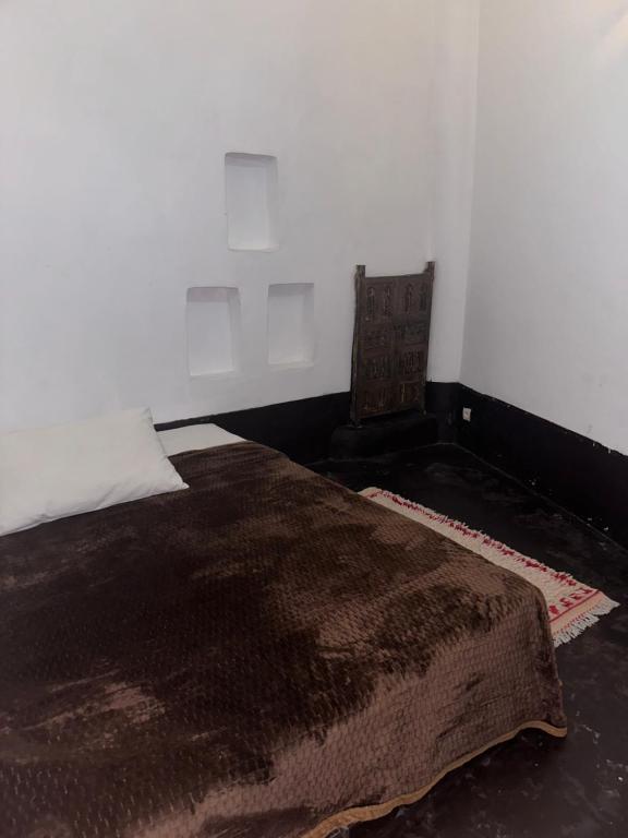 Postel nebo postele na pokoji v ubytování dar kenza