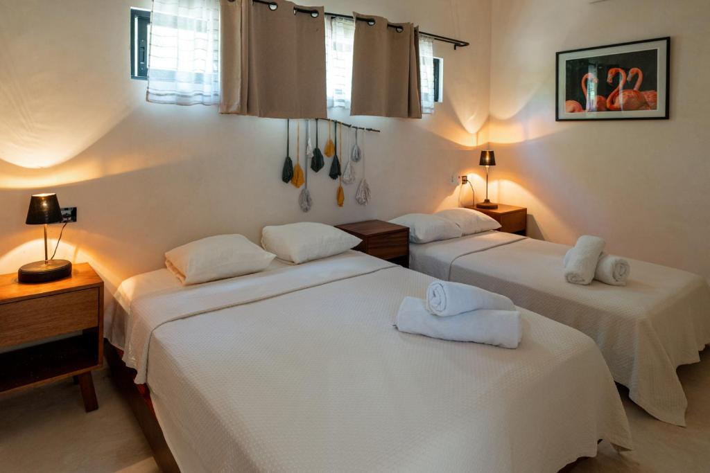 Postel nebo postele na pokoji v ubytování Casa AMI