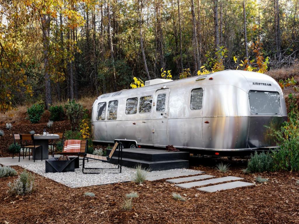a silver airstream trailer parked in a garden at AutoCamp Yosemite in Midpines