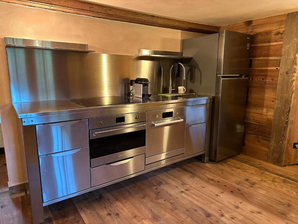 Kuchyň nebo kuchyňský kout v ubytování Casalpina Cozy chalet