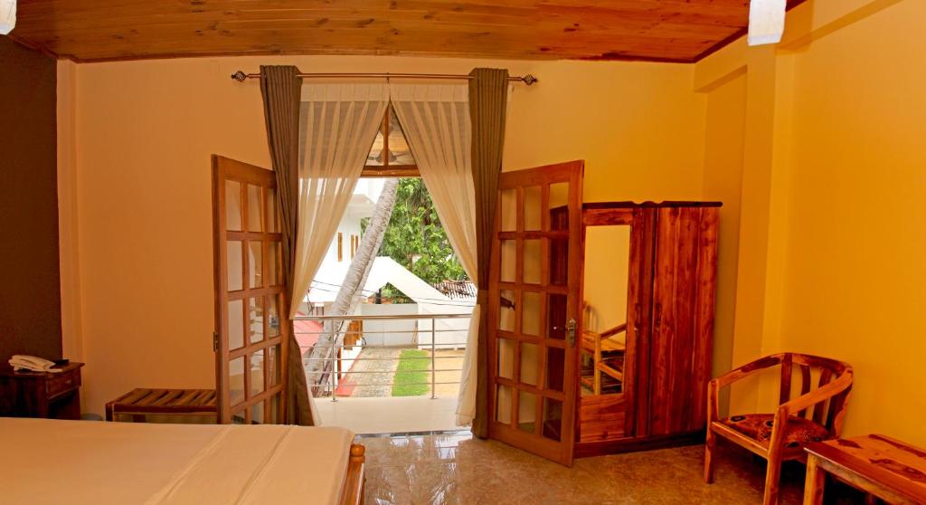 Postel nebo postele na pokoji v ubytování Bluewater Beach Resort