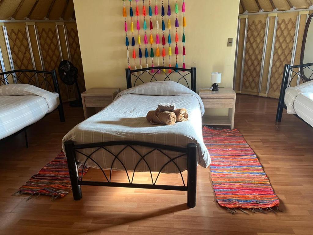 Uma cama ou camas num quarto em Altos de Quitor, Glamping