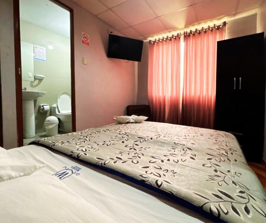 Postel nebo postele na pokoji v ubytování Hostal Wan Ka Trujillo