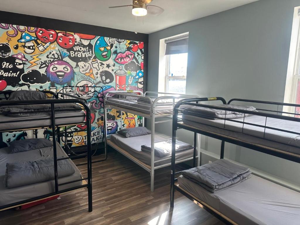 Postel nebo postele na pokoji v ubytování Queen Nest Hotel