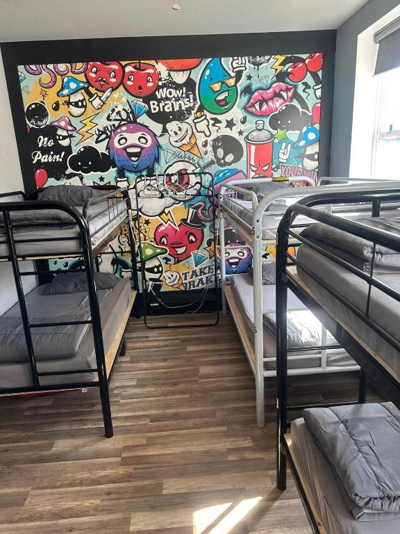 Postel nebo postele na pokoji v ubytování Queen Nest Hotel