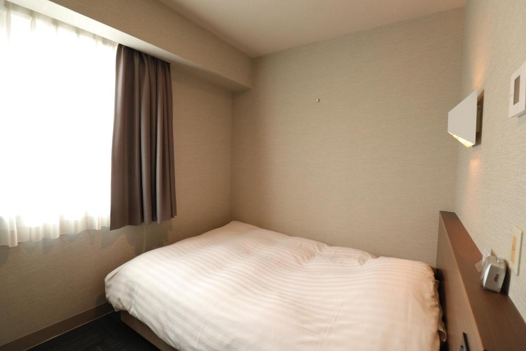 Postel nebo postele na pokoji v ubytování Silk Hotel Annex