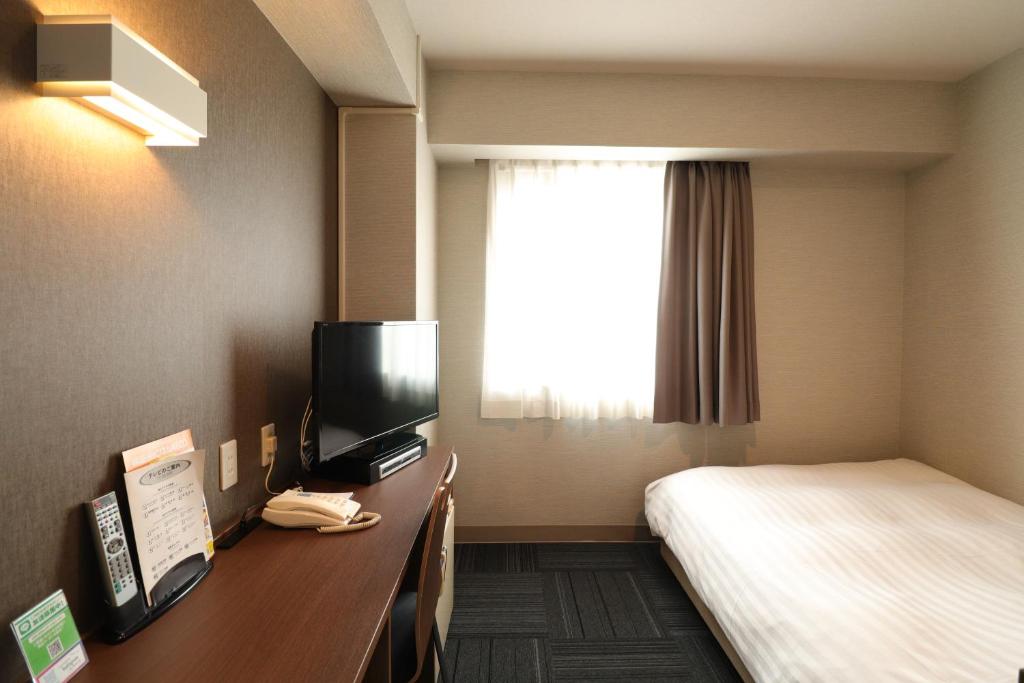 TV a/nebo společenská místnost v ubytování Silk Hotel Annex