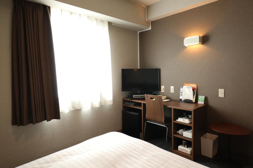 TV a/nebo společenská místnost v ubytování Silk Hotel Annex