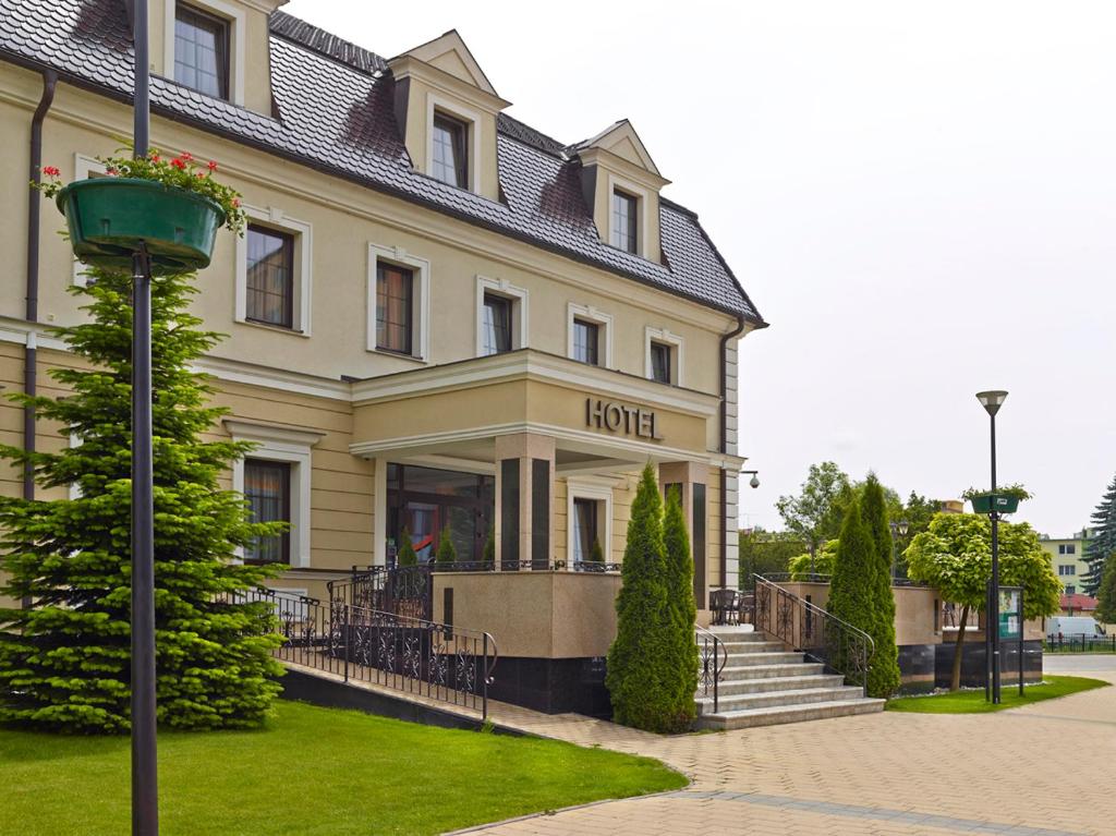 a hotel building with a street light in front of it at Hotel Stefanik in Myjava