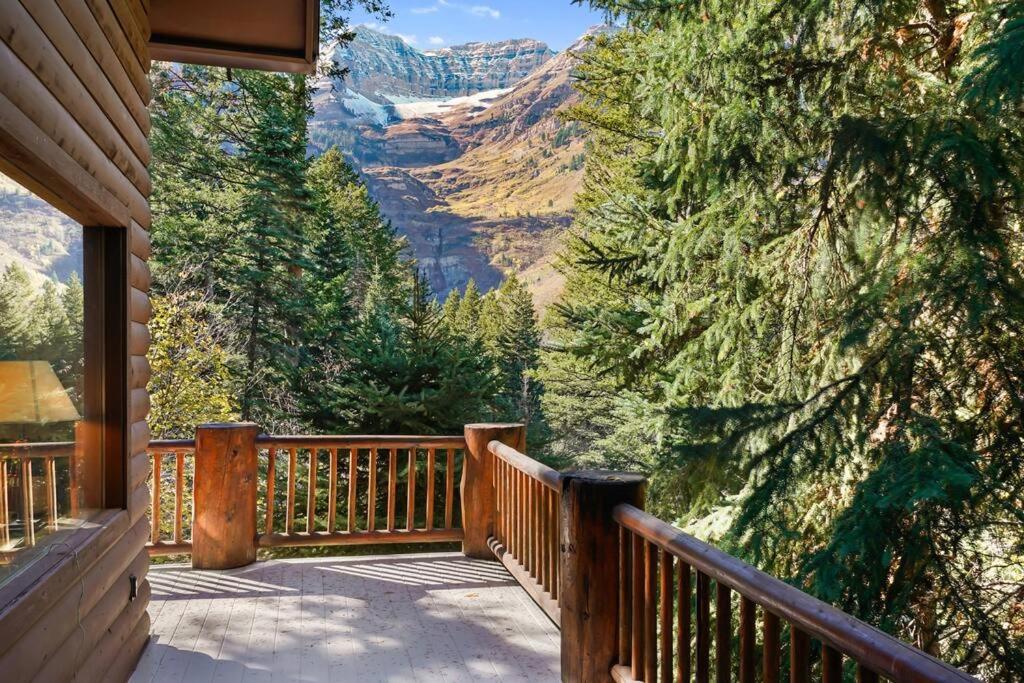 a porch of a house with a view of the mountains at Beartooth Lodge with Hot Tub and Stuart Falls Views in Sundance