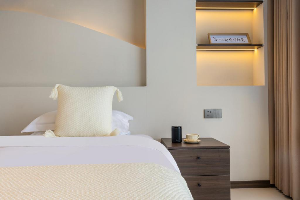 Postel nebo postele na pokoji v ubytování THAT MAY Hotel