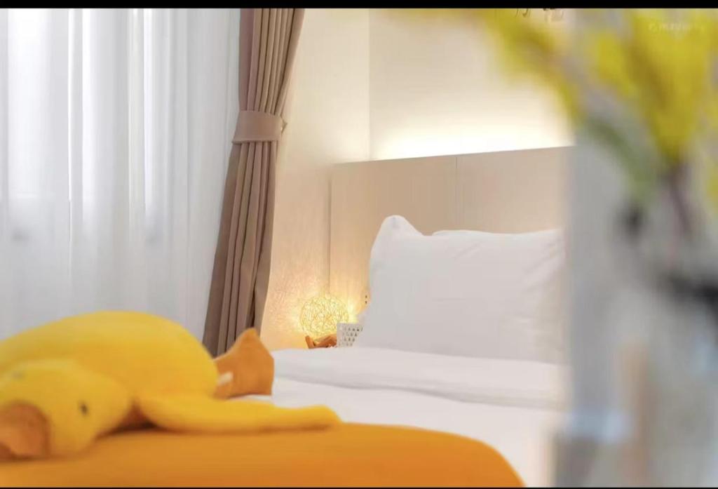 Postel nebo postele na pokoji v ubytování Xiamen Mingshu Shanqiu Homestay