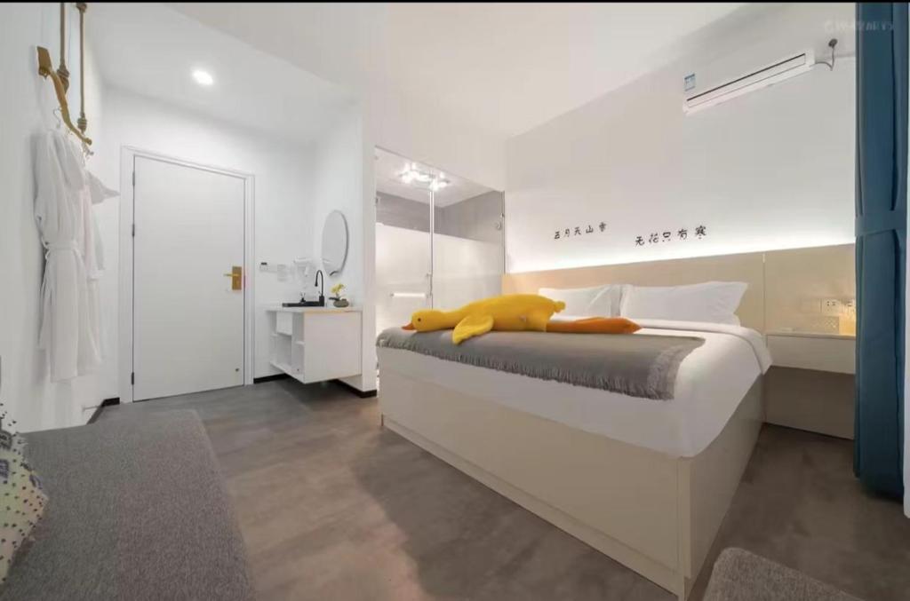 Postel nebo postele na pokoji v ubytování Xiamen Mingshu Shanqiu Homestay