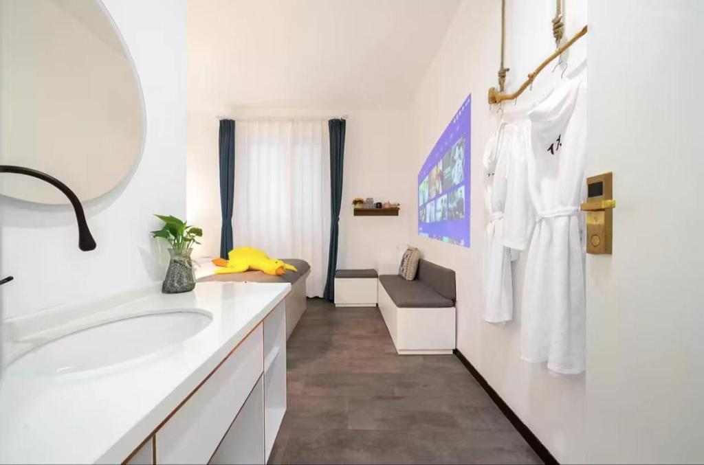 Postel nebo postele na pokoji v ubytování Xiamen Mingshu Shanqiu Homestay