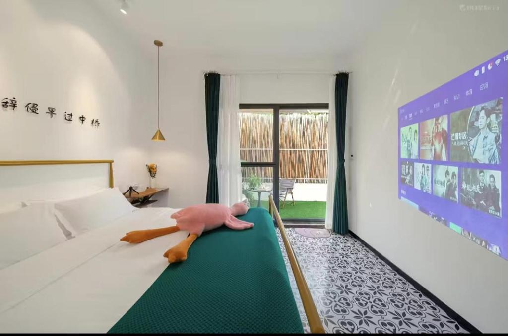 Postel nebo postele na pokoji v ubytování Xiamen Mingshu Shanqiu Homestay