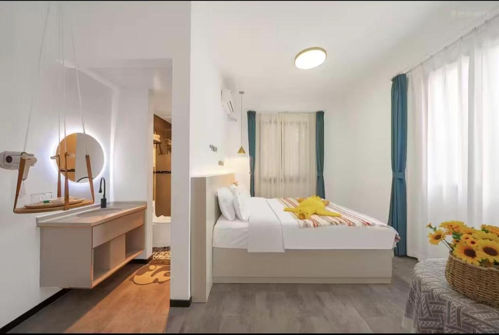 Postel nebo postele na pokoji v ubytování Xiamen Mingshu Shanqiu Homestay