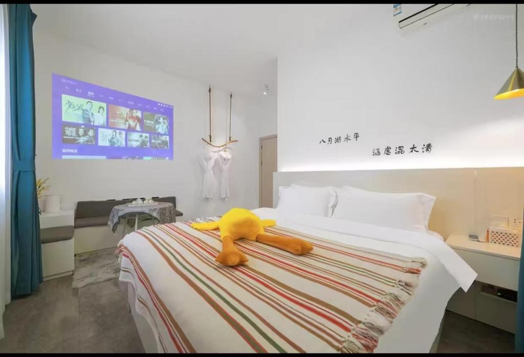 Postel nebo postele na pokoji v ubytování Xiamen Mingshu Shanqiu Homestay