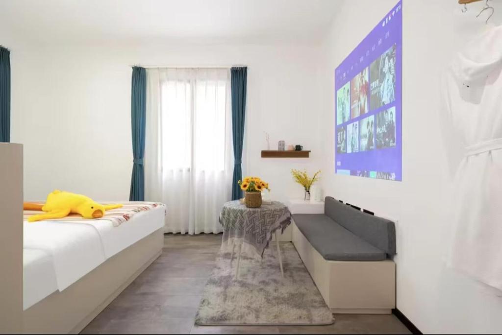 Postel nebo postele na pokoji v ubytování Xiamen Mingshu Shanqiu Homestay