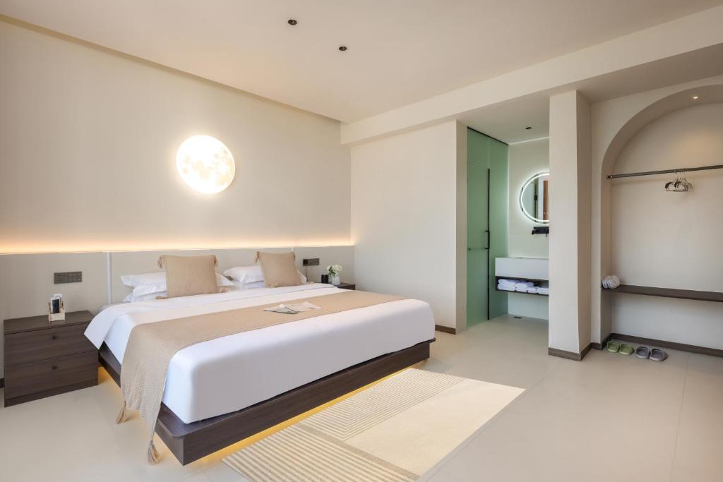 Postel nebo postele na pokoji v ubytování THAT MAY Hotel