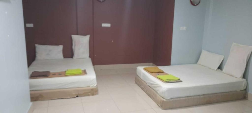 Postel nebo postele na pokoji v ubytování SV Andalas Hotel