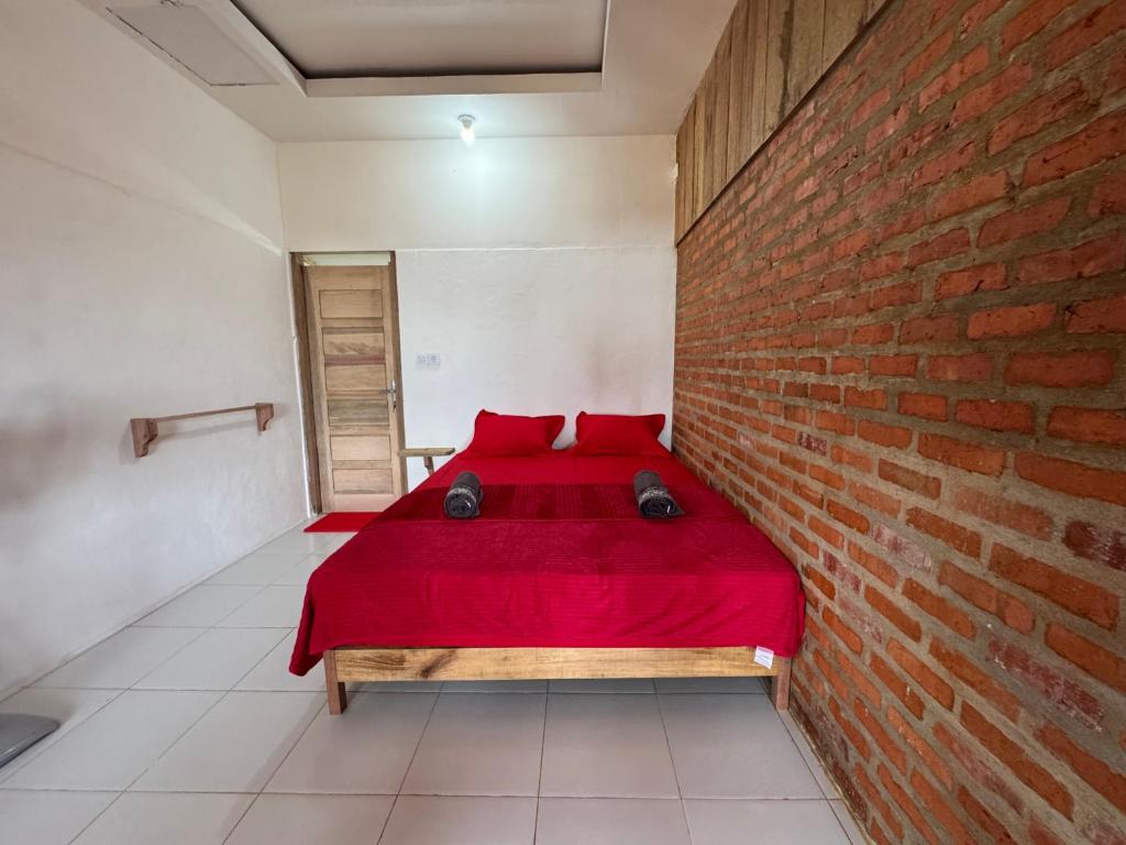 Postel nebo postele na pokoji v ubytování Simagirau Homestay