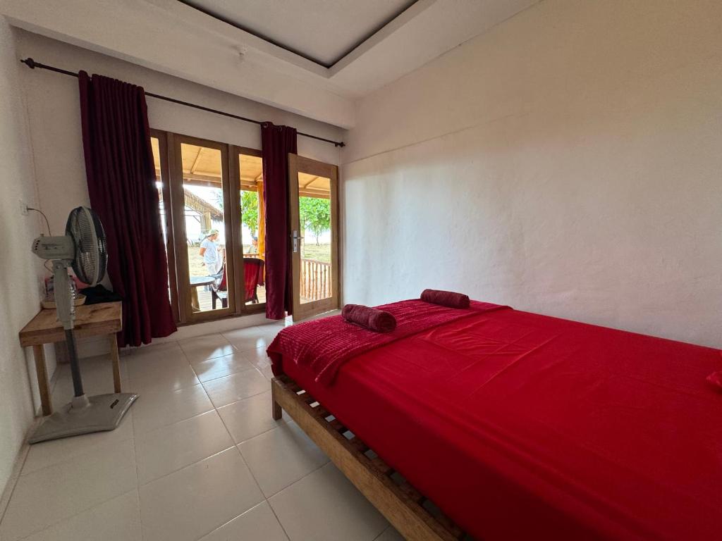 Postel nebo postele na pokoji v ubytování Simagirau Homestay