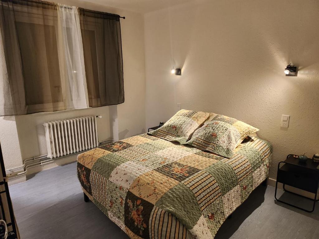 Postel nebo postele na pokoji v ubytování L'Aurigast