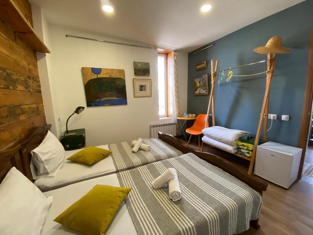 Postel nebo postele na pokoji v ubytování Gallery Guesthouse
