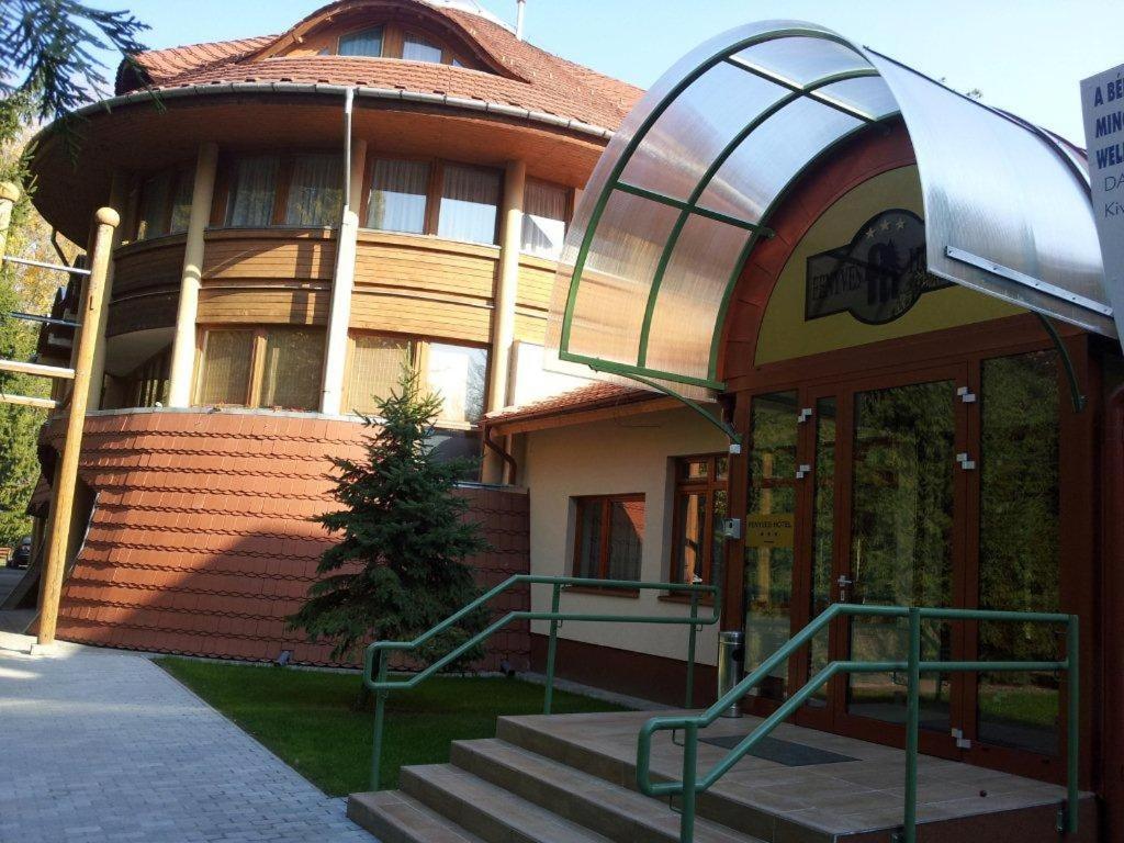 a building with a staircase in front of it at Fenyves Wellness Hotel Békéscsaba in Békéscsaba