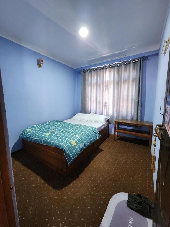 Postel nebo postele na pokoji v ubytování Hotel Garden Inn